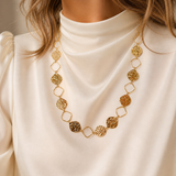 Model wearing Celeste Zircon Necklace in gold [finish:gold]