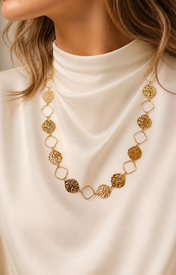 Model wearing Celeste Zircon Necklace in gold [finish:gold]