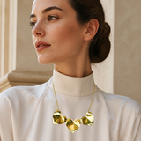 Model wearing Fiora Petal Necklace in gold [finish:gold]