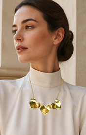 Model wearing Fiora Petal Necklace in gold [finish:gold]