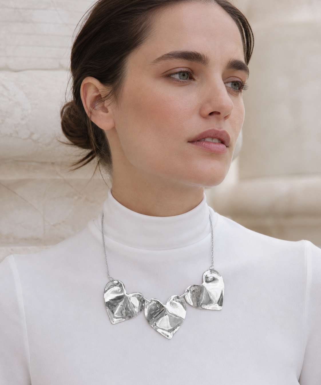 Model wearing Fiora Petal Necklace in silver [finish:silver]