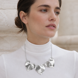 Model wearing Fiora Petal Necklace in silver [finish:silver]