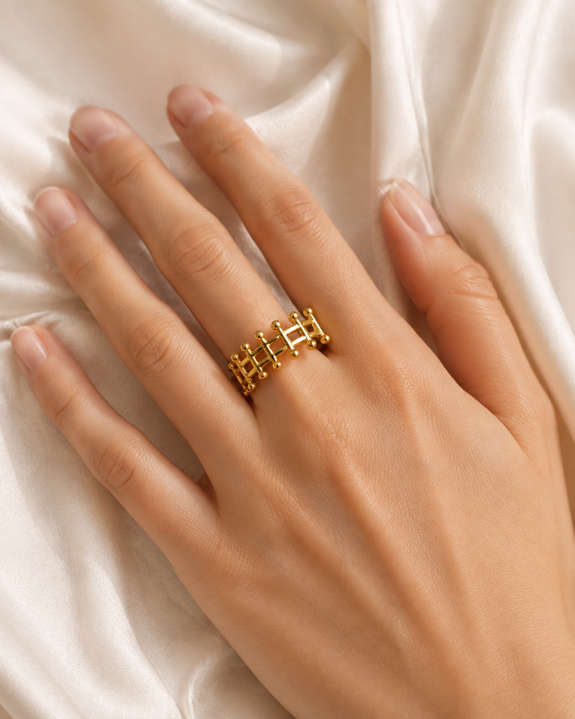 Model wearing Noelani Gold-Plated Steel Ring