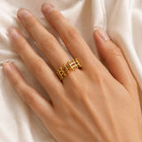 Model wearing Noelani Gold-Plated Steel Ring