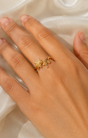 Model wearing Aveline Gold-Plated Steel Ring