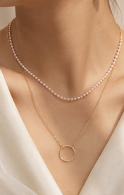 Model wearing Liora Pearl Heart Necklace — Edition 1