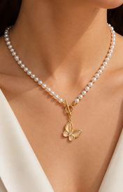Model wearing Liora Pearl Heart Necklace — No. 1