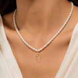 Model wearing Liora Pearl Heart Necklace — No. 2