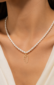 Model wearing Liora Pearl Heart Necklace — No. 2