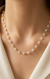 Model wearing Liora Pearl Heart Necklace — No. 3