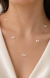 Model wearing Liora Pearl Heart Necklace — No. 4