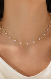 Model wearing Liora Pearl Heart Necklace — No. 60