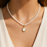 Model wearing Liora Pearl Heart Necklace — No. 6