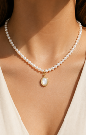 Model wearing Liora Pearl Heart Necklace — No. 6