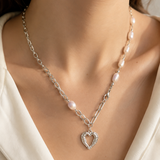 Model wearing Liora Pearl Heart Necklace — No. 10