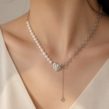 Model wearing Liora Pearl Heart Necklace — No. 11