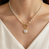 Model wearing Liora Pearl Heart Necklace — No. 12