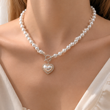 Model wearing Liora Pearl Heart Necklace — Edition 4