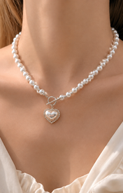 Model wearing Liora Pearl Heart Necklace — Edition 4
