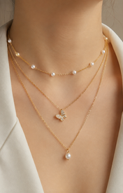 Model wearing Liora Pearl Heart Necklace — No. 28