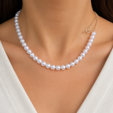 Model wearing Liora Pearl Heart Necklace — No. 34