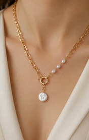 Model wearing Liora Pearl Heart Necklace — Edition 19