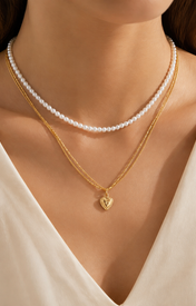 Model wearing Liora Pearl Heart Necklace