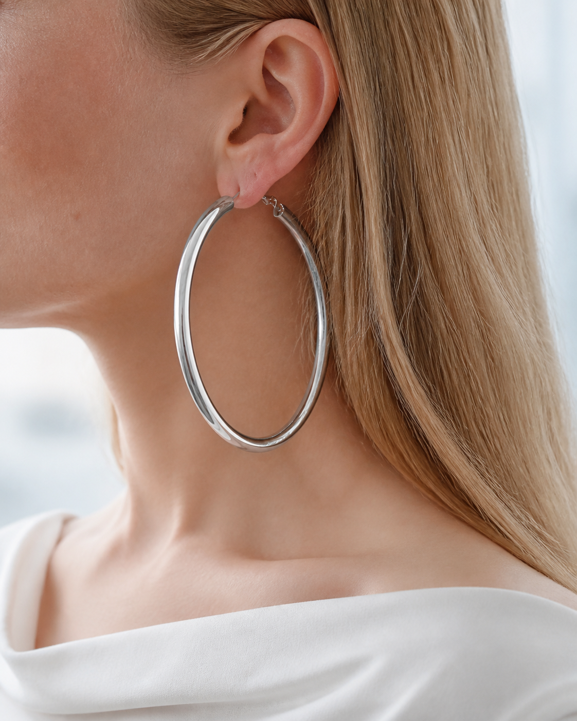 Model wearing Evara XL Hoops in silver
