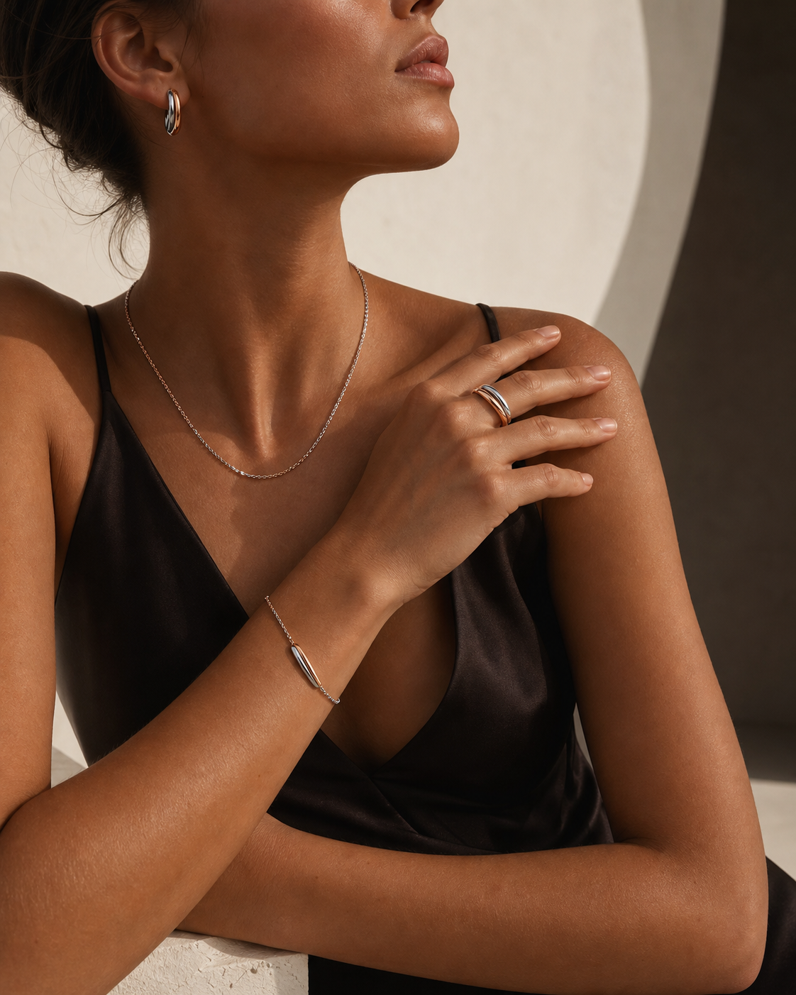 Model styling silver and rose-gold tone Zyvora jewelry